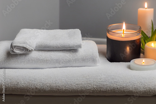 Fototapeta Naklejka Na Ścianę i Meble -  Natural relaxing spa composition, massage table in wellness center with towels,jasmine flowers salt