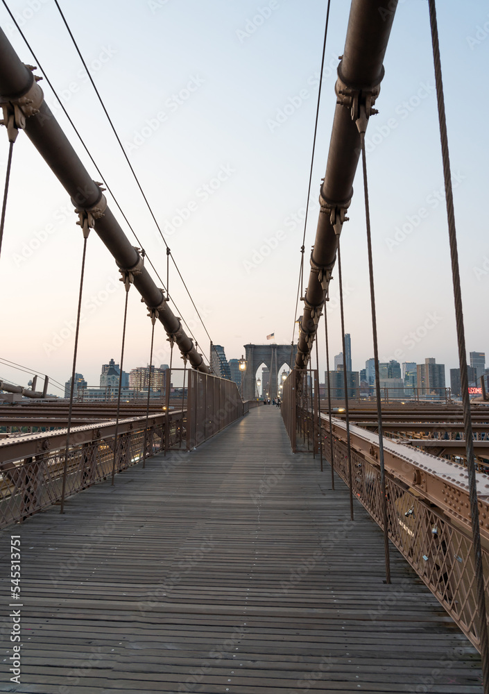 Classic view of the pedestrian part of the Brooklyn Bridge in the early morning