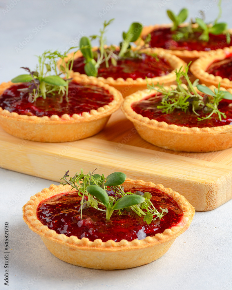 tartlet with jam on light background tartlet with jam on light background