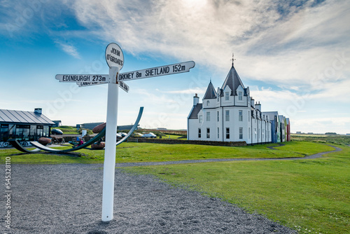 Iconic signpost at John O Groats against clear blue sky mid-summer clear blue sky Caithness Scotland.