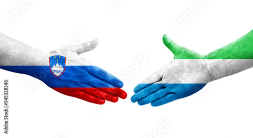Handshake between Sierra Leone and Slovenia flags painted on hands, isolated transparent image.