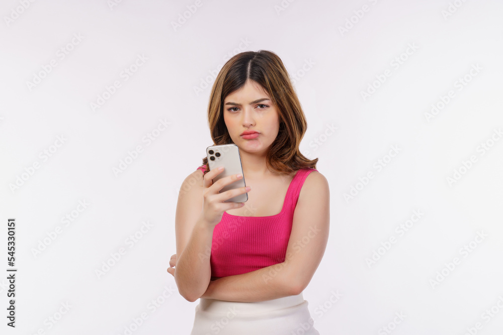 Portrait of confused young woman using mobile phone isolated over white background Portrait of confused young woman using mobile phone isolated over white background
