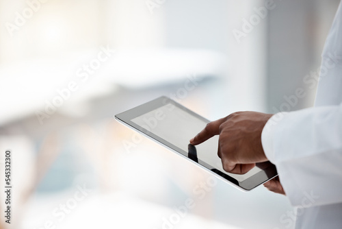 Black doctor, hands and tablet online research for results, communication and connect. Medical professional, digital device and typing for innovation, data analyzing and information technology.
