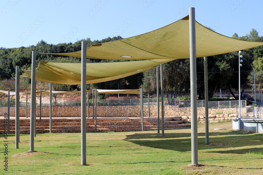 Canopy in the city park to protect from the scorching sun. Canopy in the city park to protect from the scorching sun.