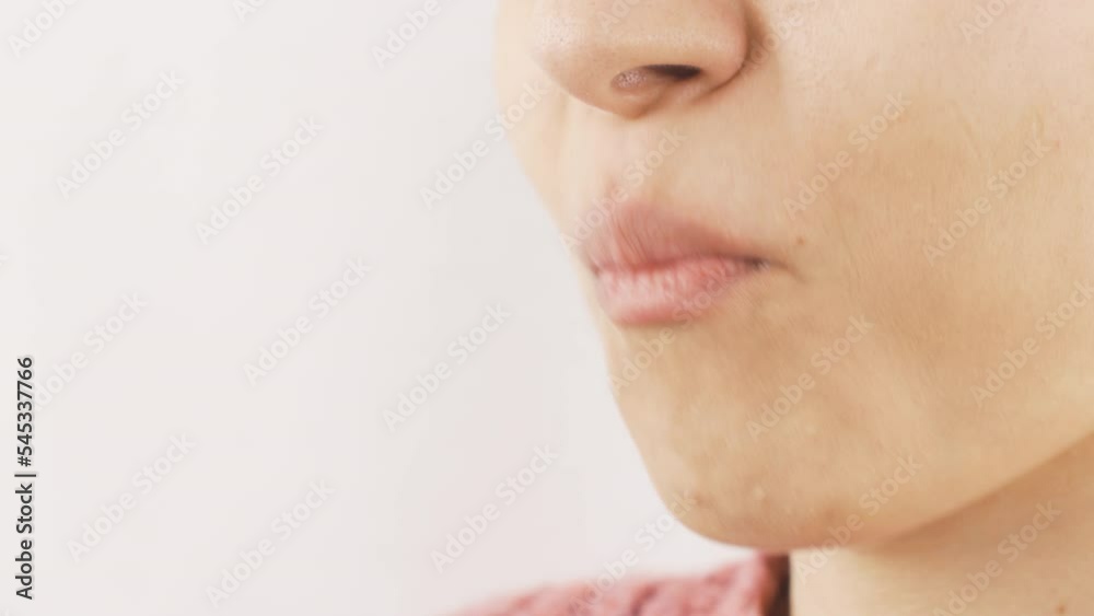 Close-up of woman eating dragee. Eating chocolate.
Close-up portrait of woman eating dragee.
