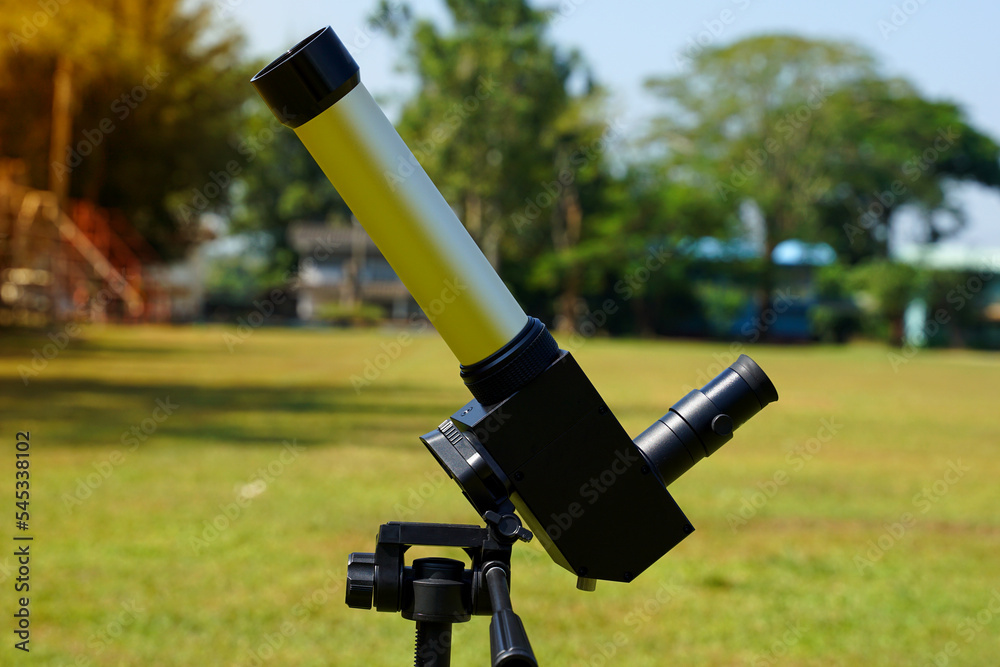 sun telescope set on the lawn in the school that the teacher has prepared for students to observe the phenomena and details of the sun such as sun points, solar eclipses, solar flares, etc. sun telescope set on the lawn in the school that the teacher has prepared for students to observe the phenomena and details of the sun such as sun points, solar eclipses, solar flares, etc.