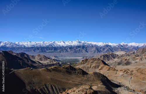 The Stok Range, with Stok Kangri (6123m) and Leh city, seen from the Khardung La Pass, Ladakh, India photo