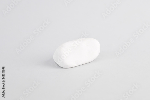 White pebble stone on gray background