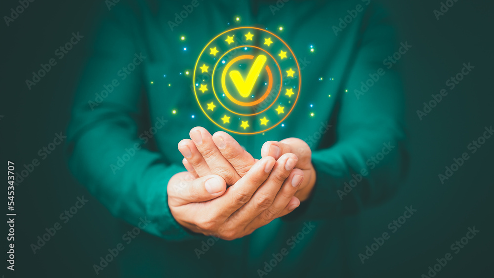 Quality assurance of business services, Businessman holding and showing the best quality assurance with golden five stars. Guarantee, Standards, ISO certification and testimonial concept. Quality assurance of business services, Businessman holding and showing the best quality assurance with golden five stars. Guarantee, Standards, ISO certification and testimonial concept.