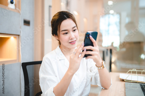 Smiling young Asian busines...