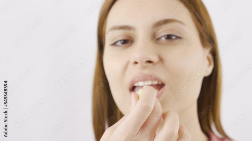 Woman eating cashew in close-up. Nuts.
Woman eating fresh cashew close-up.
Woman eating cashew in close-up. Nuts.
Woman eating fresh cashew close-up.