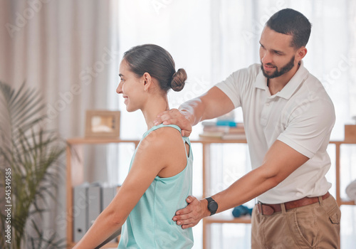 Chiropractor, woman and massage for physical therapy, health and posture at wellness clinic. Doctor, girl and spine alignment for medical, chiropractic or rehabilitation with help in physiotherapy