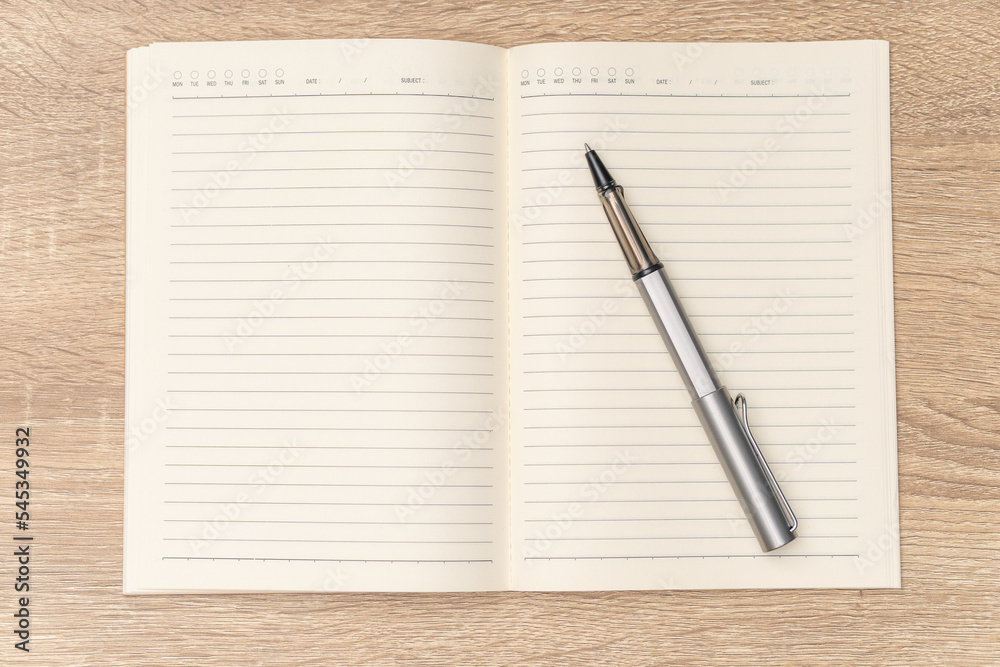 Rollerball pen is placed on the blank notebook. The notebook have lines and day boxes and subject. It seems someone is going to write the journall, diary, planner or to-do list.
Rollerball pen is placed on the blank notebook. The notebook have lines and day boxes and subject. It seems someone is going to write the journall, diary, planner or to-do list.
