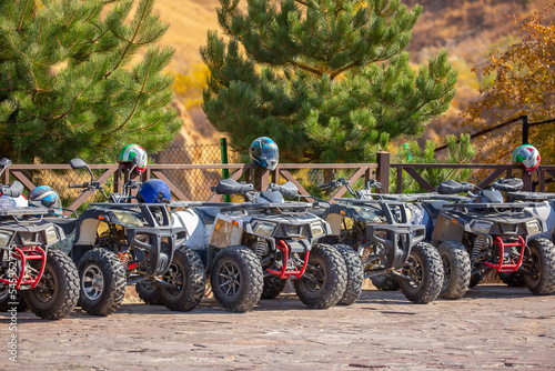 ATVs in the parking lot are rented in the recreation area. Quad bike and equipment. Extreme Entertainment. Kazakhstan, Shymkent - October 17, 2022