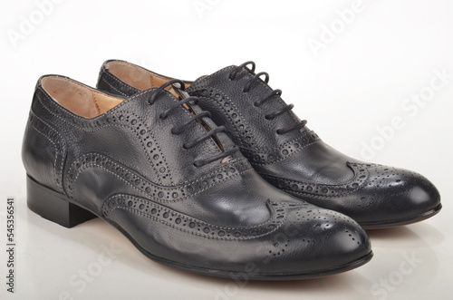 pair of black leather shoes.