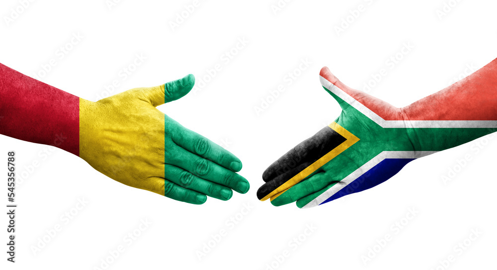 Handshake between South Africa and Guinea flags painted on hands, isolated transparent image. Handshake between South Africa and Guinea flags painted on hands, isolated transparent image.
