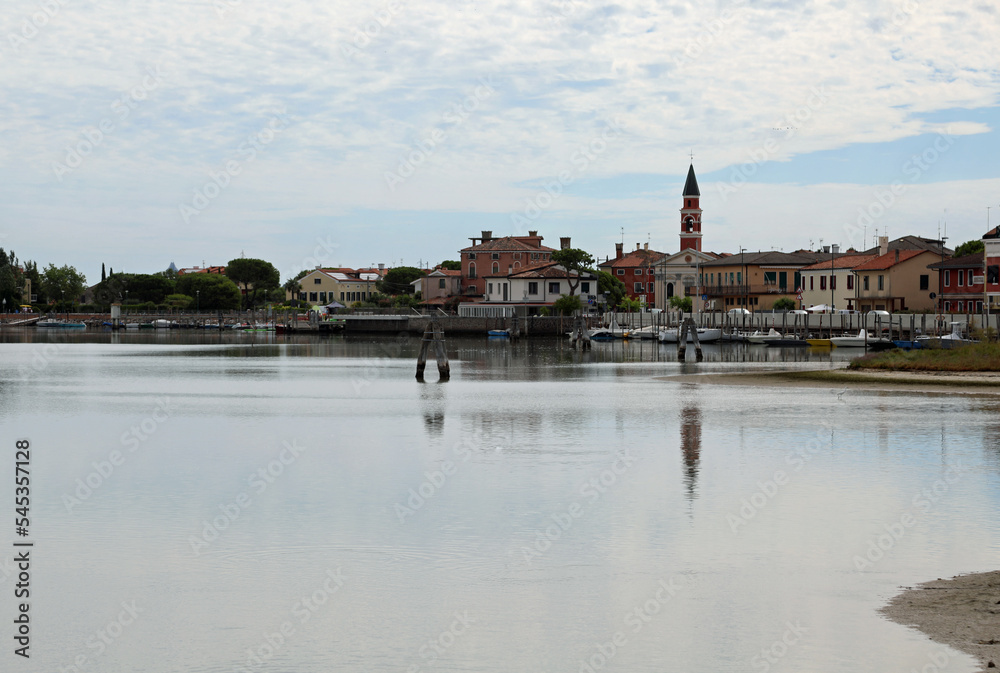 Venetion lagoon and bell tower of church in CAVALLINO Town in Italy