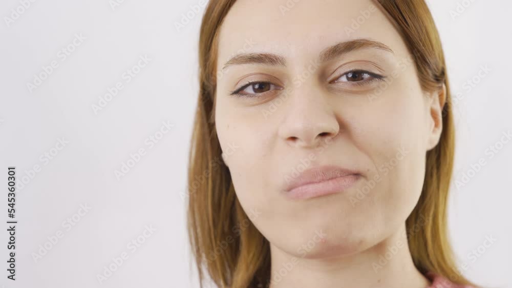 Close-up portrait of woman eating Turkish delight.
Close-up of woman eating Turkish delight.
