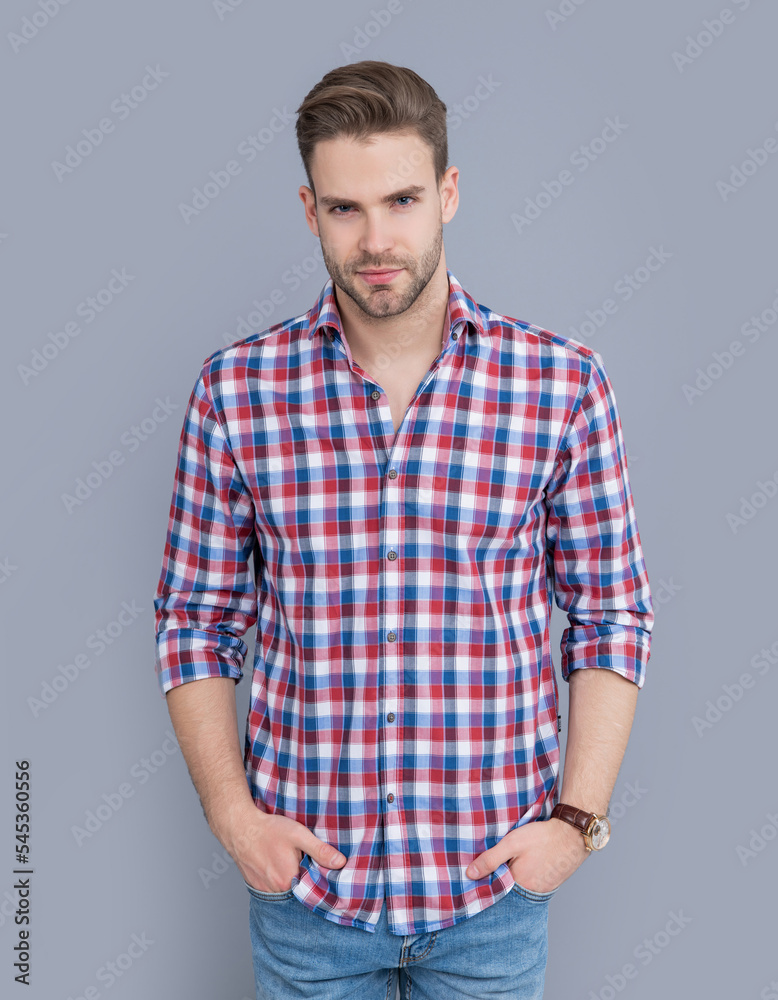 stylish guy in checkered shirt isolated on grey background. guy in stylish casual shirt. stylish guy in checkered shirt isolated on grey background. guy in stylish casual shirt.