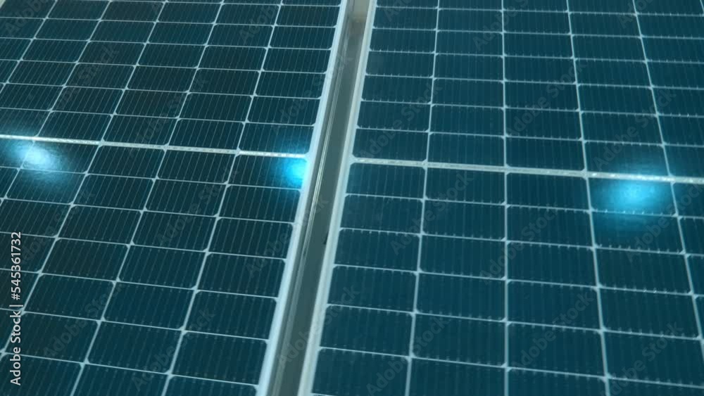 Solar battery, solar panel - a combination of photoelectric converters (photocells) - semiconductor devices that directly convert solar energy into direct electric current. Shot in motion. Closeup Solar battery, solar panel - a combination of photoelectric converters (photocells) - semiconductor devices that directly convert solar energy into direct electric current. Shot in motion. Closeup