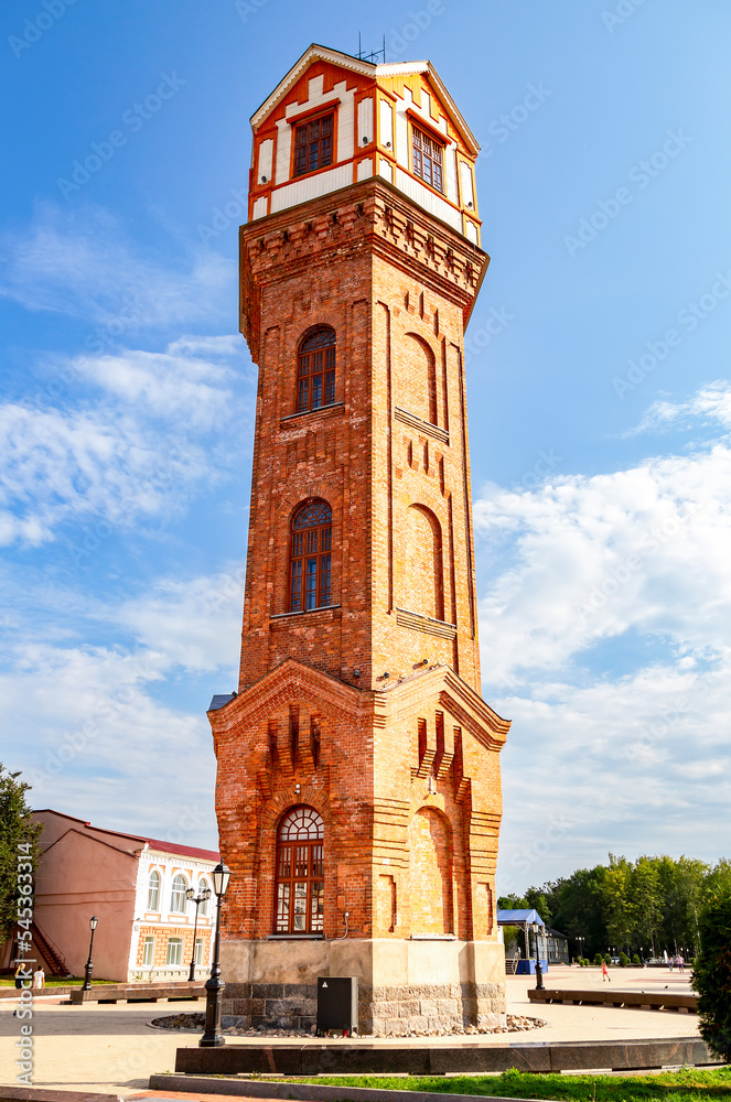 Fototapeta premium Old water tower on the city square