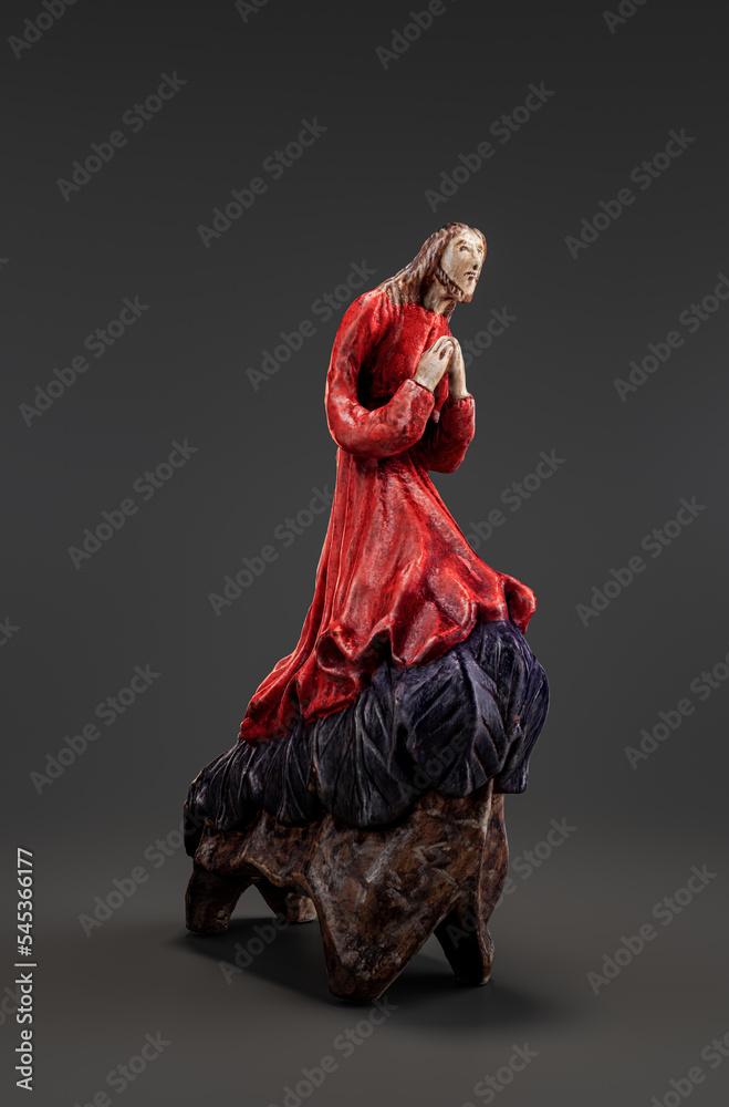 Sculpture of Christ in the Garden of Gethsemane. Jesus is praying on the Mount of Olives. Wooden