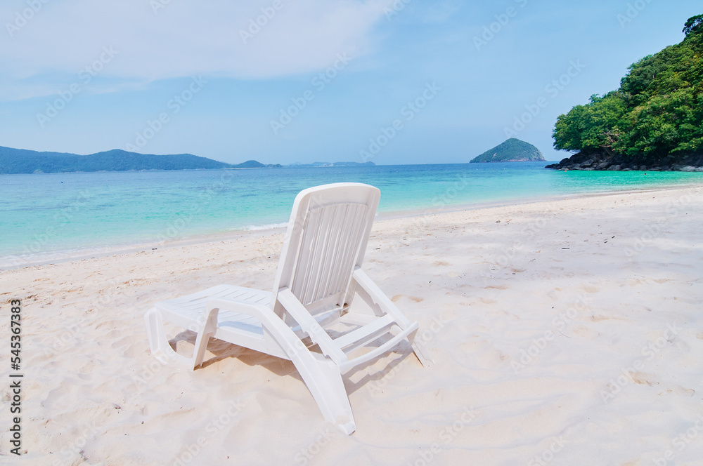 Vacation concept. Traveling by Thailand. Tropical Sea Beach with sunloungers.