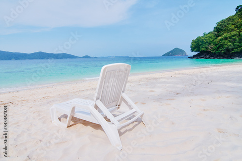 Vacation concept. Traveling by Thailand. Tropical Sea Beach with sunloungers. © luengo_ua
