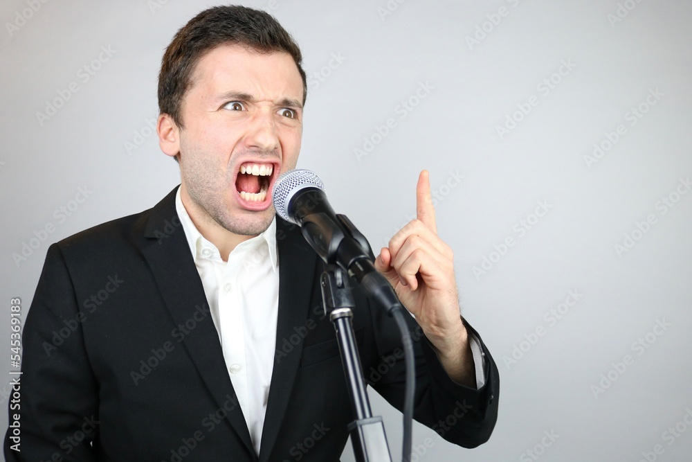 Naklejka premium Angry politician Man talking in the Microphone 