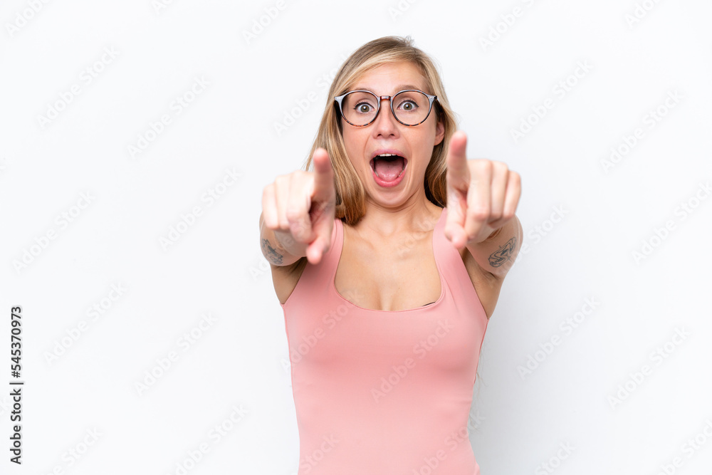 Young caucasian woman isolated on white background surprised and pointing front Young caucasian woman isolated on white background surprised and pointing front