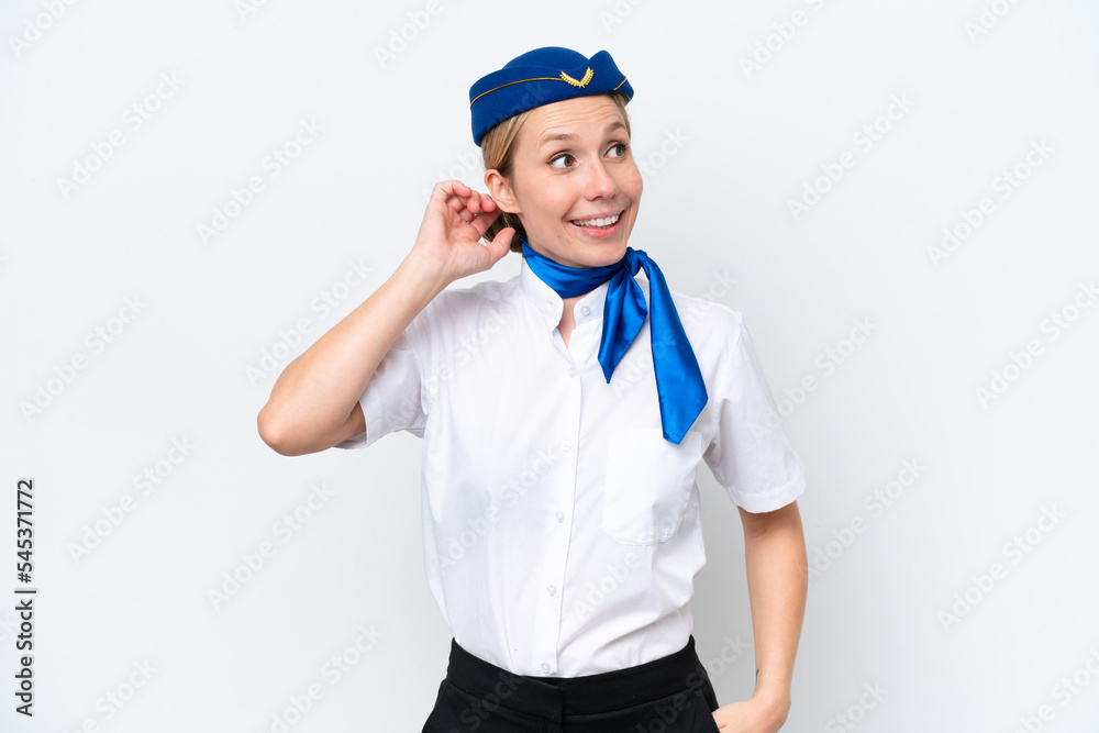 Airplane blonde stewardess woman isolated on white background thinking an idea Airplane blonde stewardess woman isolated on white background thinking an idea