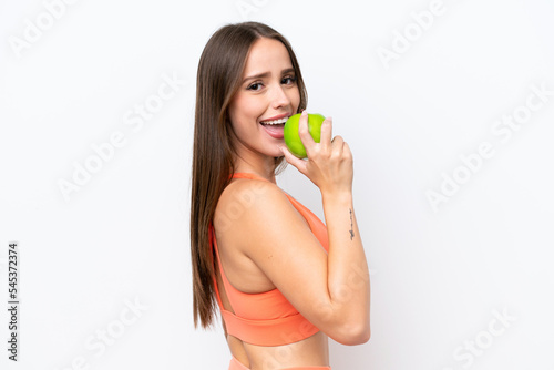 Young beautiful caucasian woman isolated on white background eating an apple