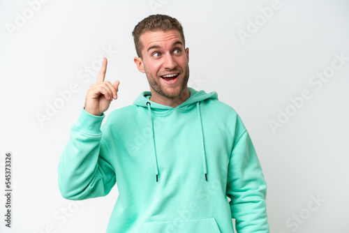 Young handsome caucasian man isolated on white background intending to realizes the solution while lifting a finger up © luismolinero