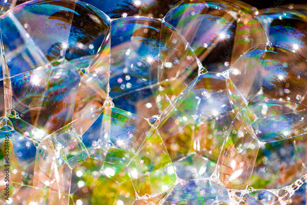 Colorful soap bubbles connected to each other Colorful soap bubbles connected to each other