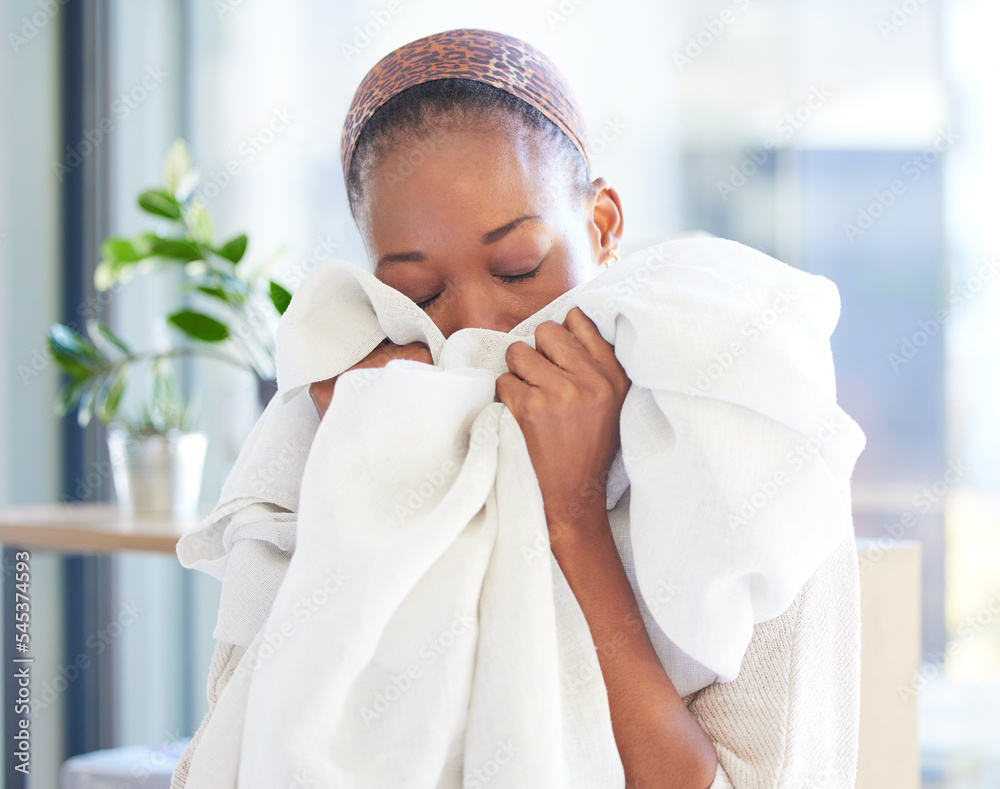Ταπετσαρία Linen, cleaning and fresh with a black woman smelling fabric or textile while working in a home as a cleaner