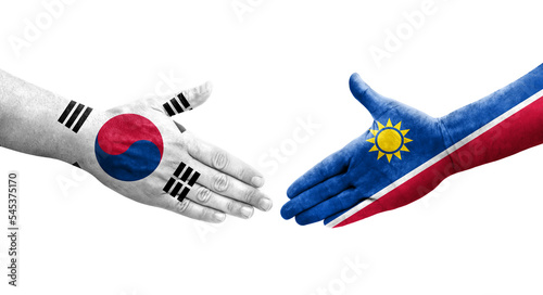 Handshake between South Korea and Namibia flags painted on hands, isolated transparent image.