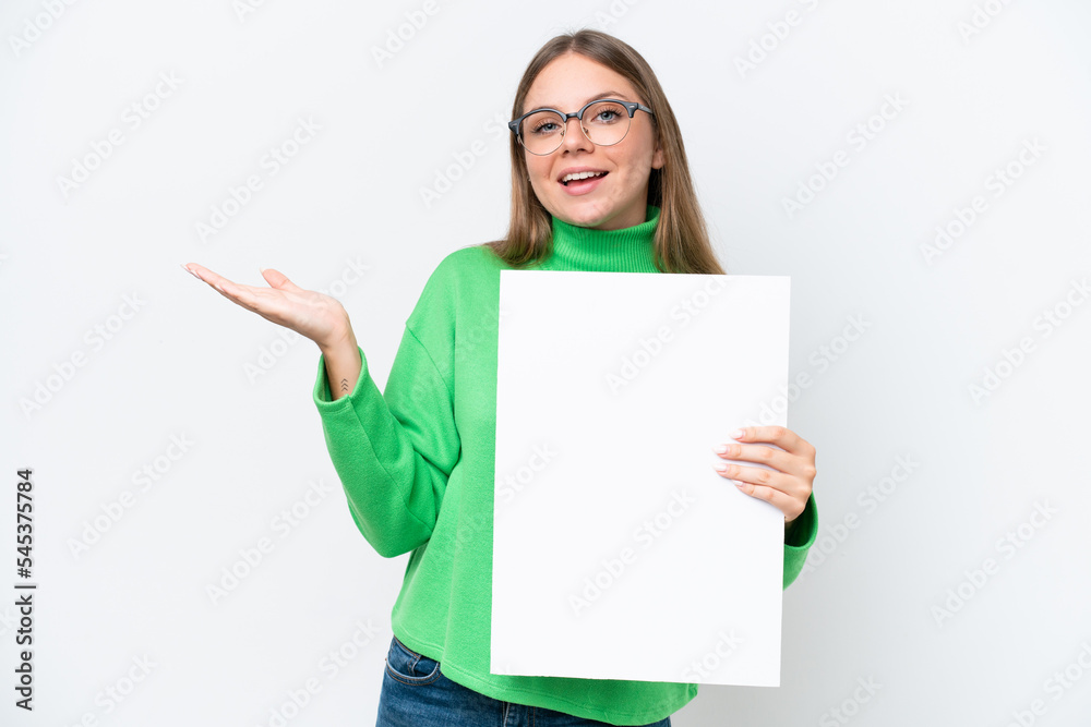 Young caucasian woman isolated on white background holding an empty placard with surprised expression Young caucasian woman isolated on white background holding an empty placard with surprised expression