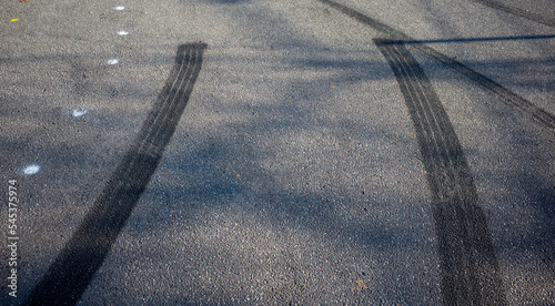 skid marks on a road surface. acceleration or braking marks left by street race drivers 