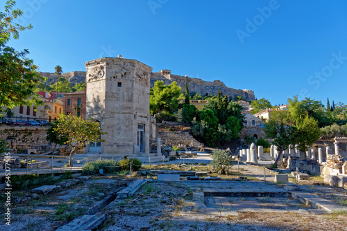 The Wind's Tower in the Roman forum, under Acropolis hill and the crystal clear blue sky. A beautiful day in Athens, Greece. photo