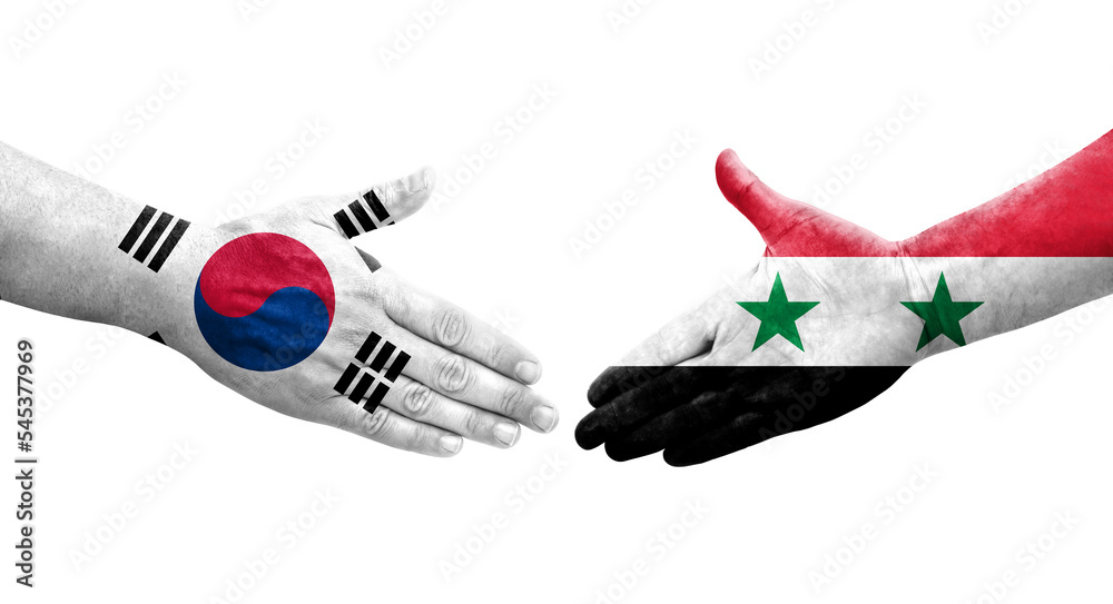 Handshake between South Korea and Syria flags painted on hands, isolated transparent image.