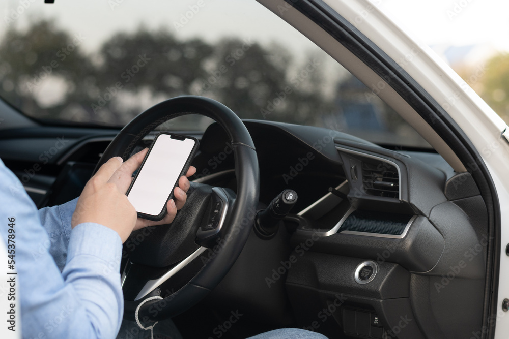 Driver showing a smartphone with a white screen