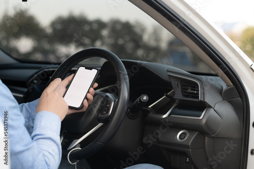 Driver showing a smartphone with a white screen