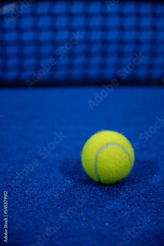Padel ball nearby the net © German
