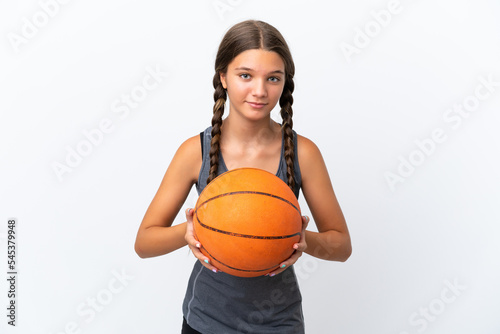 Little caucasian girl isolated on white background playing basketball