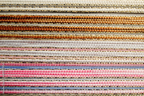 Woven texture multicolored background. Seamless fabric background