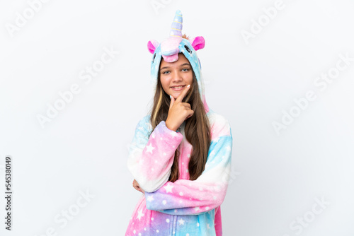 Little caucasian girl wearing unicorn pajama isolated on white background smiling