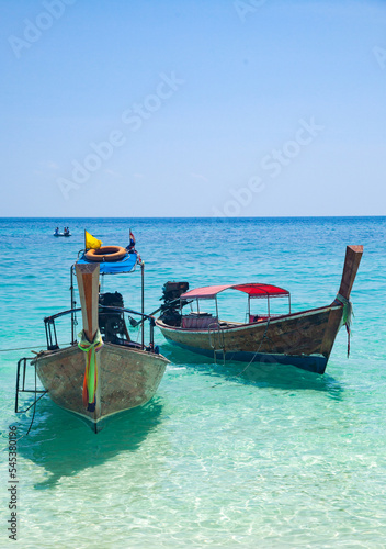 beautiful tropical beach in Thailand with longtail boats © Melinda Nagy