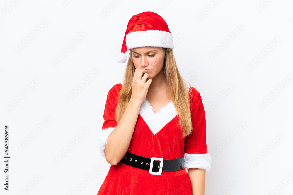 Young caucasian woman dressed as mama noel isolated on white background having doubts Young caucasian woman dressed as mama noel isolated on white background having doubts