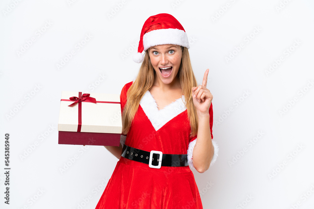 Young caucasian woman dressed as mama noel holding gift isolated on white background pointing up a great idea Young caucasian woman dressed as mama noel holding gift isolated on white background pointing up a great idea