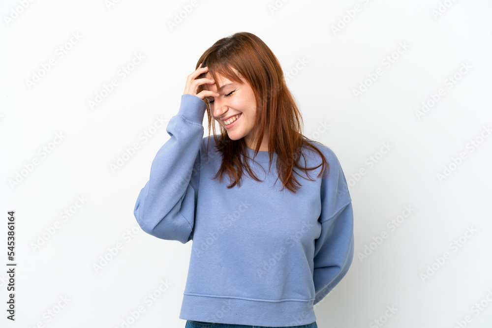 Redhead girl isolated on white background laughing Redhead girl isolated on white background laughing